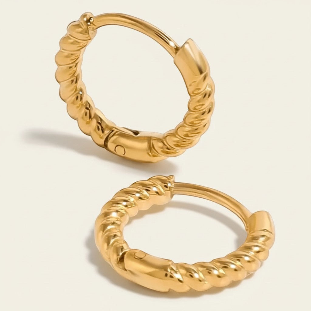Seraphina Treasures gold twisted hoop earrings with a modern, delicate design. Lightweight and elegant for daily wear.