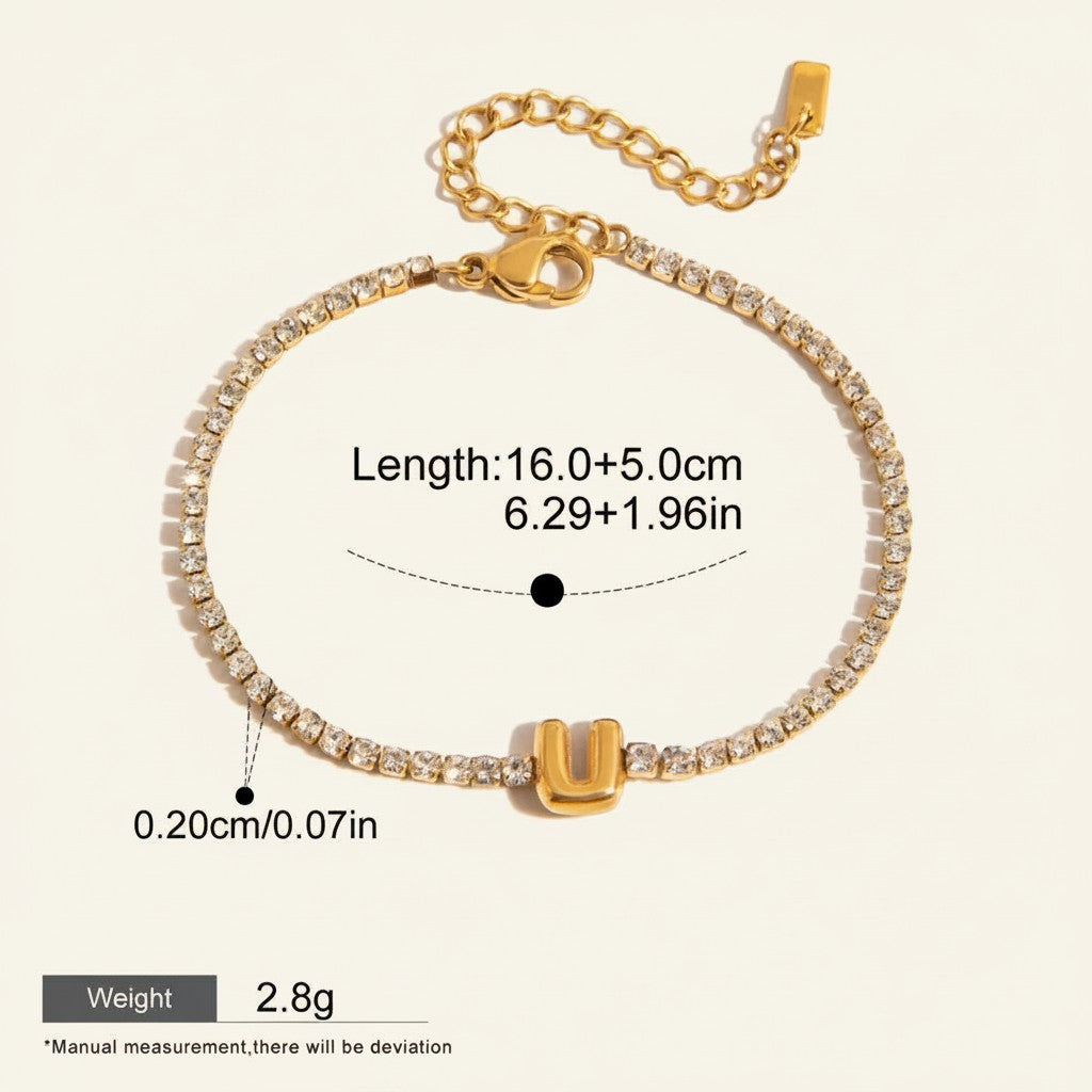Seraphina Treasures gold-tone bracelet with clear zirconia stones and a gold 'U' initial pendant. Waterproof and hypoallergenic.