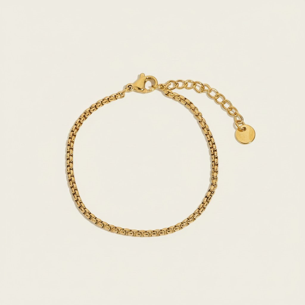 Seraphina Treasures gold-tone stainless steel Vedara bracelet with adjustable clasp and disc charm.