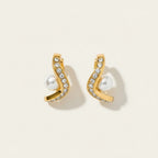 Seraphina Treasures gold wave earrings with clear crystals and pearl accent. Elegant and lightweight.