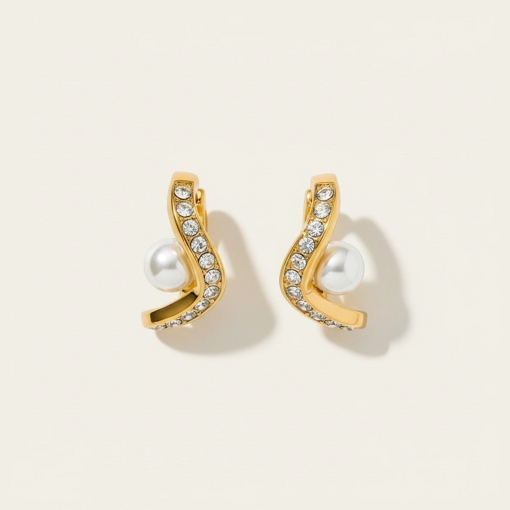 Seraphina Treasures gold wave earrings with clear crystals and pearl accent. Elegant and lightweight.