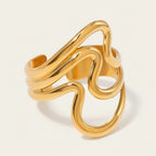 Seraphina Treasures Lyrica gold open ring with irregular wavy design and glossy ripple texture.
