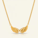 Seraphina Treasures gold wing necklace with zircon stones, symbolizing freedom and grace.