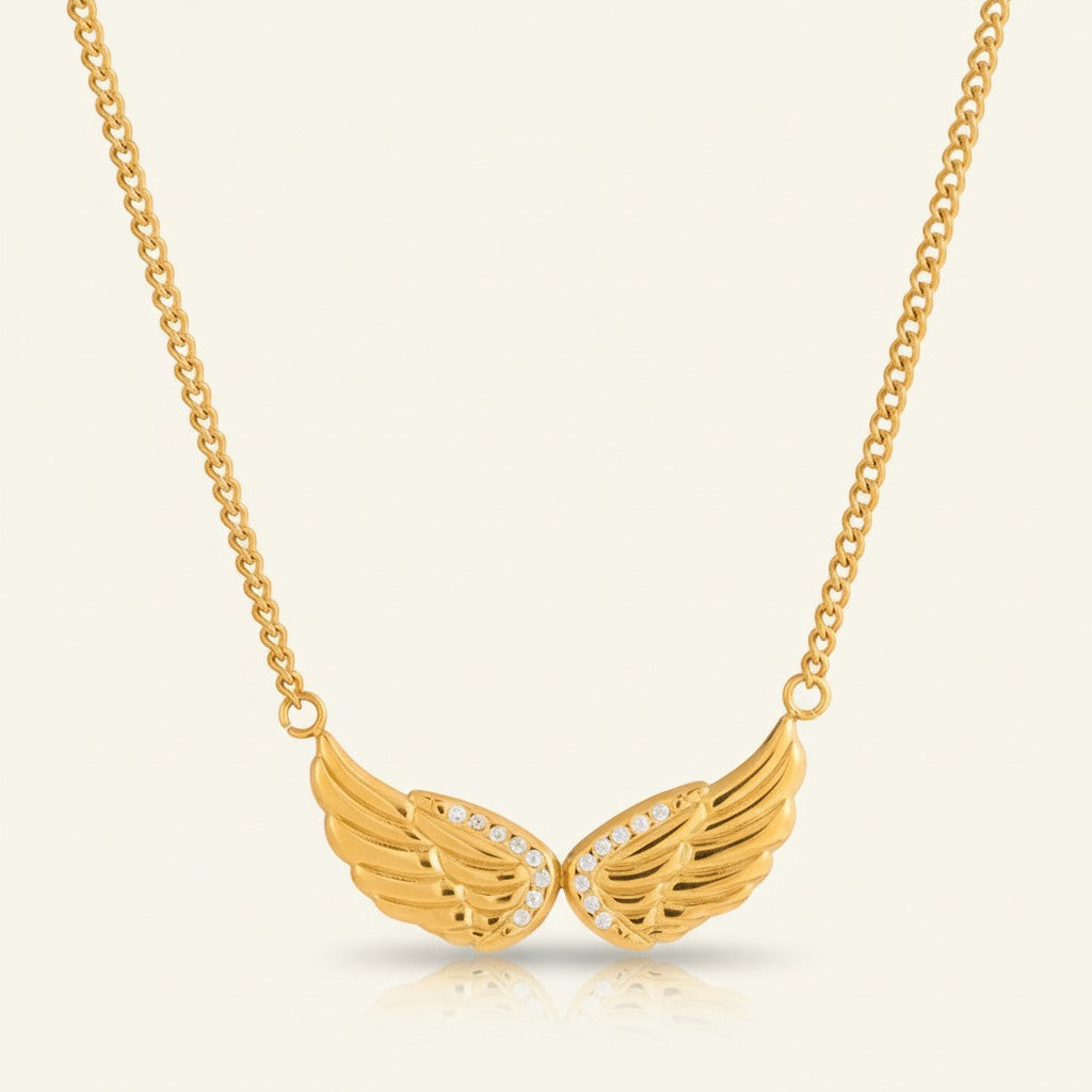 Seraphina Treasures gold wing necklace with zircon stones, symbolizing freedom and grace.