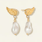 Seraphina Treasures gold wing earrings with pearl drops and zircon accents. Elegant, sophisticated design.
