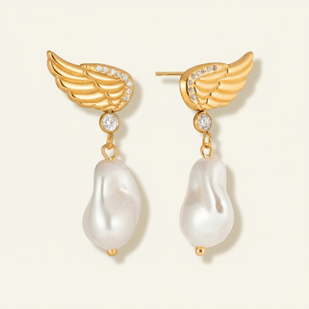 Seraphina Treasures gold wing earrings with pearl drops and zircon accents. Elegant, sophisticated design.
