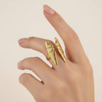 Seraphina Treasures gold-tone open ring with delicate wing details, symbolizing protection and grace.