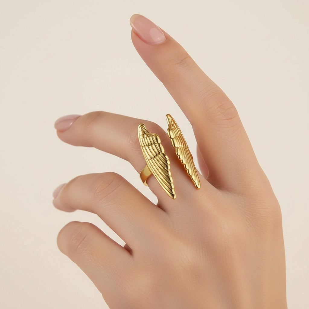 Seraphina Treasures gold-tone open ring with delicate wing details, symbolizing protection and grace.