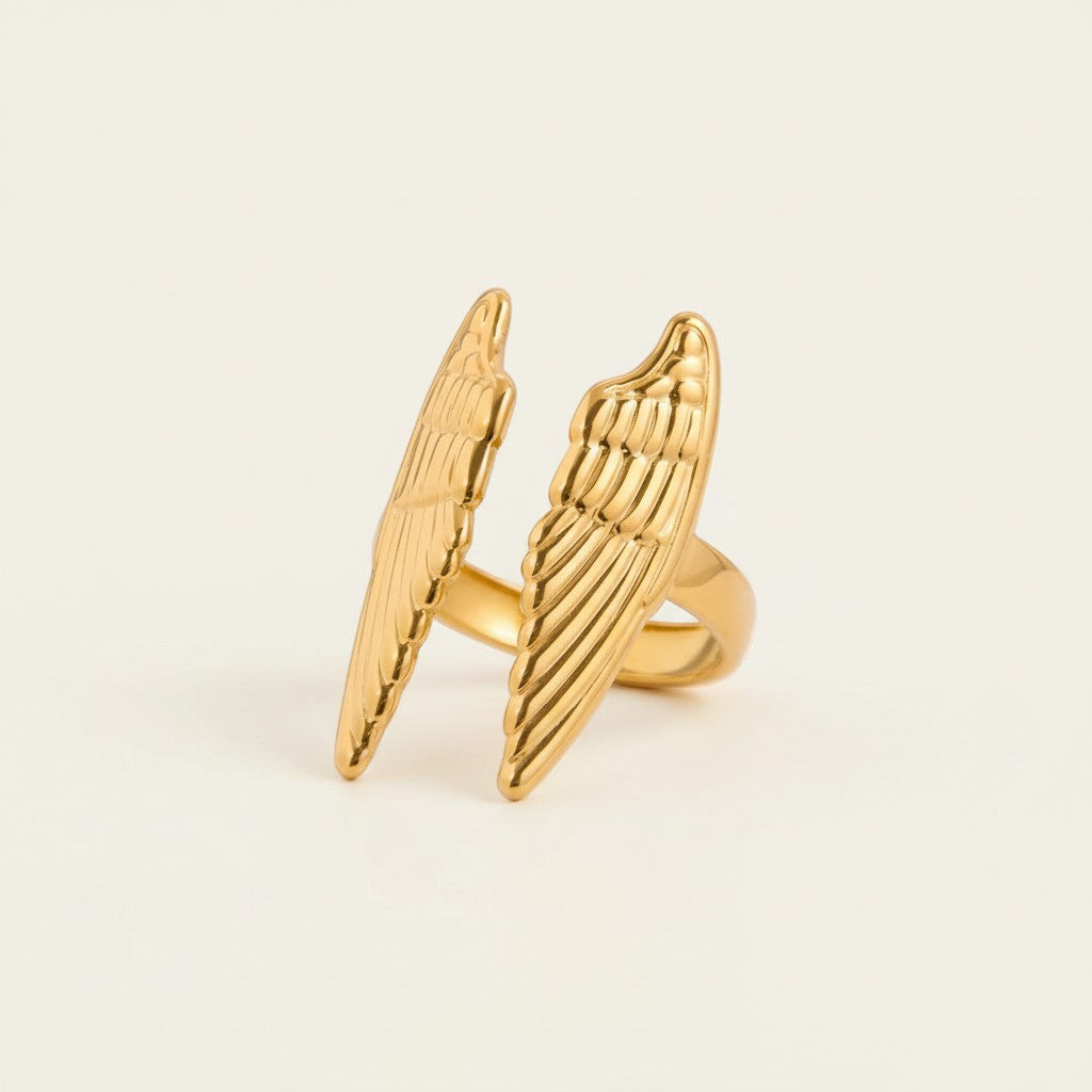 Seraphina Treasures gold open wing ring, symbolizing protection and grace. Delicate details add ethereal beauty.