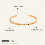 Seraphina Treasures gold-tone open cuff bracelet with colorful zircon stones, adjustable and waterproof.