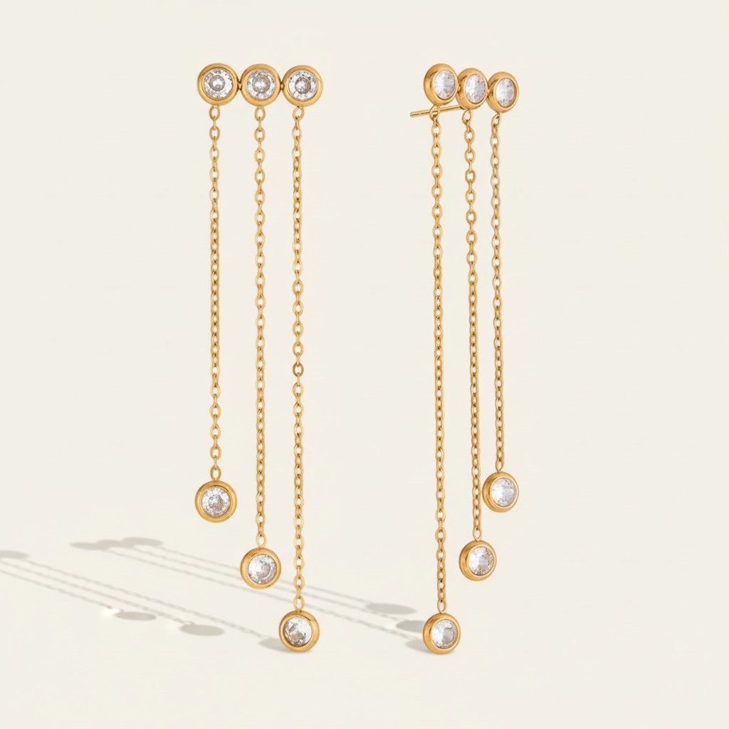 Seraphina Treasures gold plated earrings with three sparkling zircon pendants on delicate long chains, cascading design.