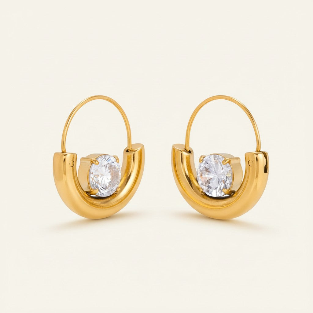 Seraphina Treasures Valeryth gold hoop earrings with round clear zircon centerpiece. Delicate and elegant.