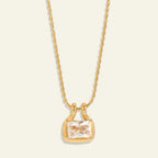 Seraphina Treasures gold necklace with a rectangular clear zircon pendant and a beaded chain.