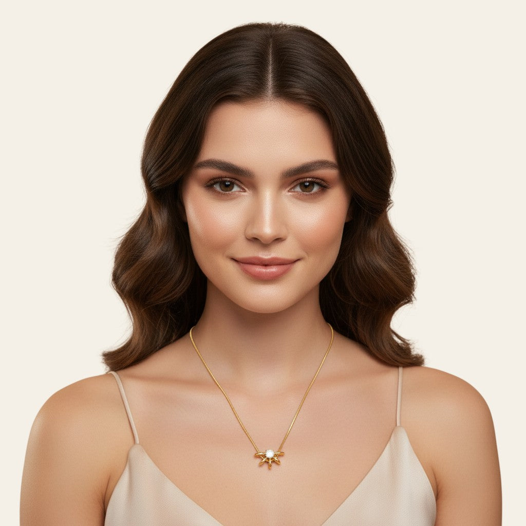Seraphina Treasures gold necklace with a central clear zircon stone and a unique hollow circle pendant with radiating gold accents.