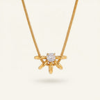 Seraphina Treasures gold necklace with a central clear zircon stone surrounded by a hollow circle design with delicate gold spokes.
