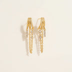 Seraphina Treasures gold-tone metal earrings with zircon pendants and chain tassels.