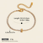 Seraphina Treasures gold-tone bracelet with clear zirconia stones and a small gold bar pendant. Adjustable chain.