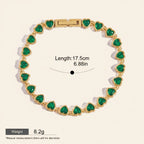 Seraphina Treasures gold-tone bracelet with green heart-shaped zirconia stones. Features a sleek chain and secure clasp. Waterproof and hypoallergenic.