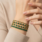 Seraphina Treasures gold bracelets with green zirconia stones in round, heart, and baguette cuts. Accented with clear stones.