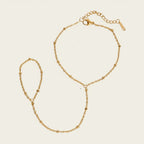 Seraphina Treasures Helia gold-tone connected bracelet and ring set with delicate bead accents.