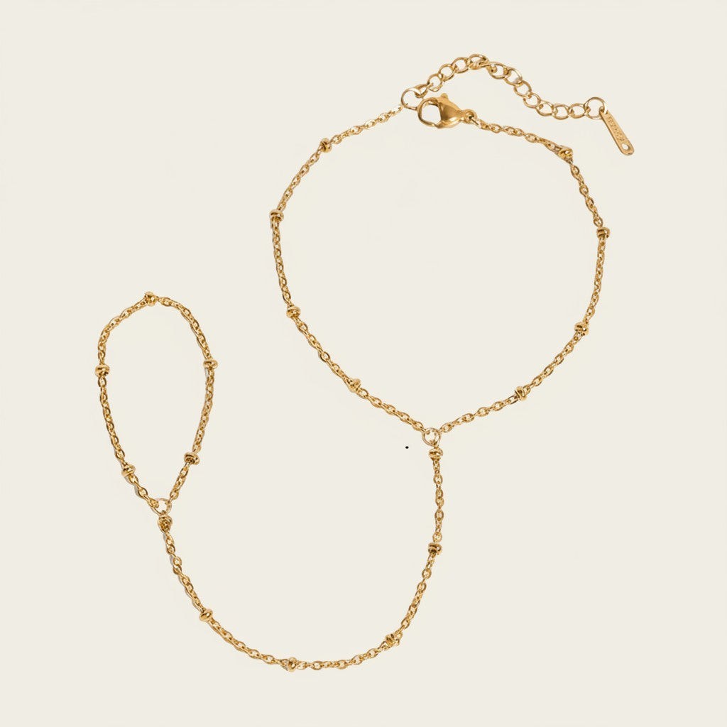 Seraphina Treasures Helia gold-tone connected bracelet and ring set with delicate bead accents.