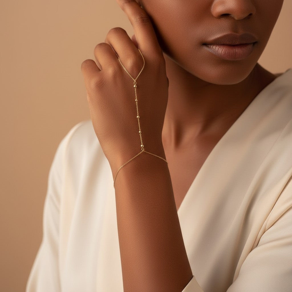 Seraphina Treasures Helia gold hand chain bracelet and ring set with delicate bead details.