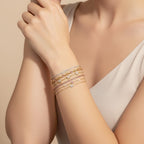 Seraphina Treasures Hestia bracelets: gold chains with cubic zirconia, pink stones, and butterfly charms.