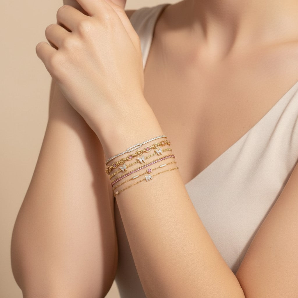 Seraphina Treasures Hestia bracelets: gold chains with cubic zirconia, pink stones, and butterfly charms.