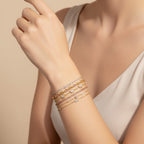 Seraphina Treasures Hestia bracelets: gold chains with cubic zirconia and pink stones, featuring butterfly and rectangular charms.