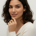 Seraphina Treasures Hexara gold layered ring with geometric shapes on a model's finger.