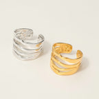Seraphina Treasures Hexara ring in gold and silver, featuring a layered geometric design with a hammered finish.