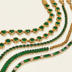 Seraphina Treasures Hortensia bracelet with green zirconia stones in heart and round shapes on a gold chain.