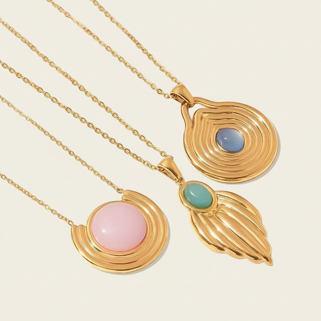 Seraphina Treasures Ignatia necklaces with blue, pink, and turquoise stones in gold-tone metal.