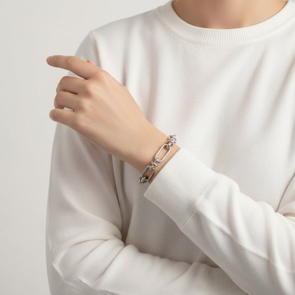 Seraphina Treasures Isolde silver-tone metal link bracelet with knot details and secure clasp.