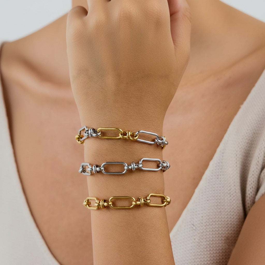 Seraphina Treasures Isolde bracelet with gold and silver interlocking oval links and a cross clasp.