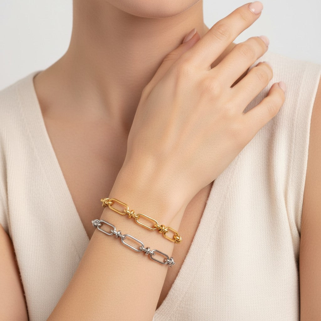 Seraphina Treasures Isolde two-tone link bracelet with cross clasp, available in gold and silver.