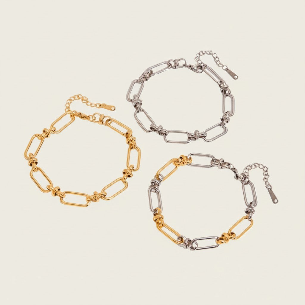 Seraphina Treasures Isolde two-tone link bracelet with cross clasp, available in gold and silver.