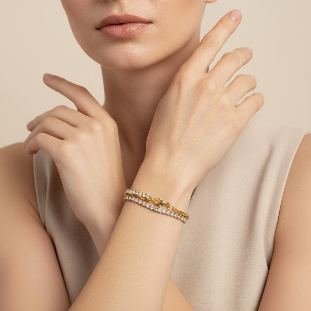 Seraphina Treasures Ithela bracelet with two delicate gold chains adorned with shimmering stones. Worn on a woman's wrist.