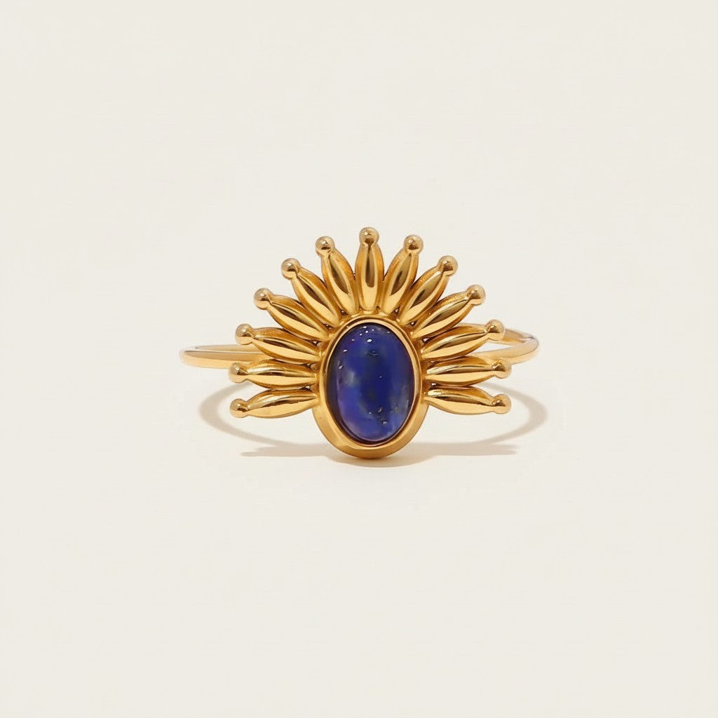 Seraphina Treasures Jettara ring with oval lapis stone set in a golden sunburst open band. Adjustable.