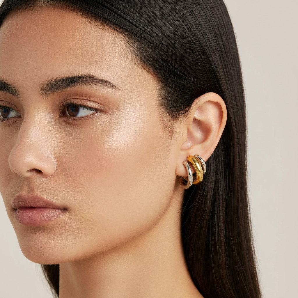 Seraphina Treasures Jovira ear clip with a geometric, layered design in gold and silver tones. No piercing needed.