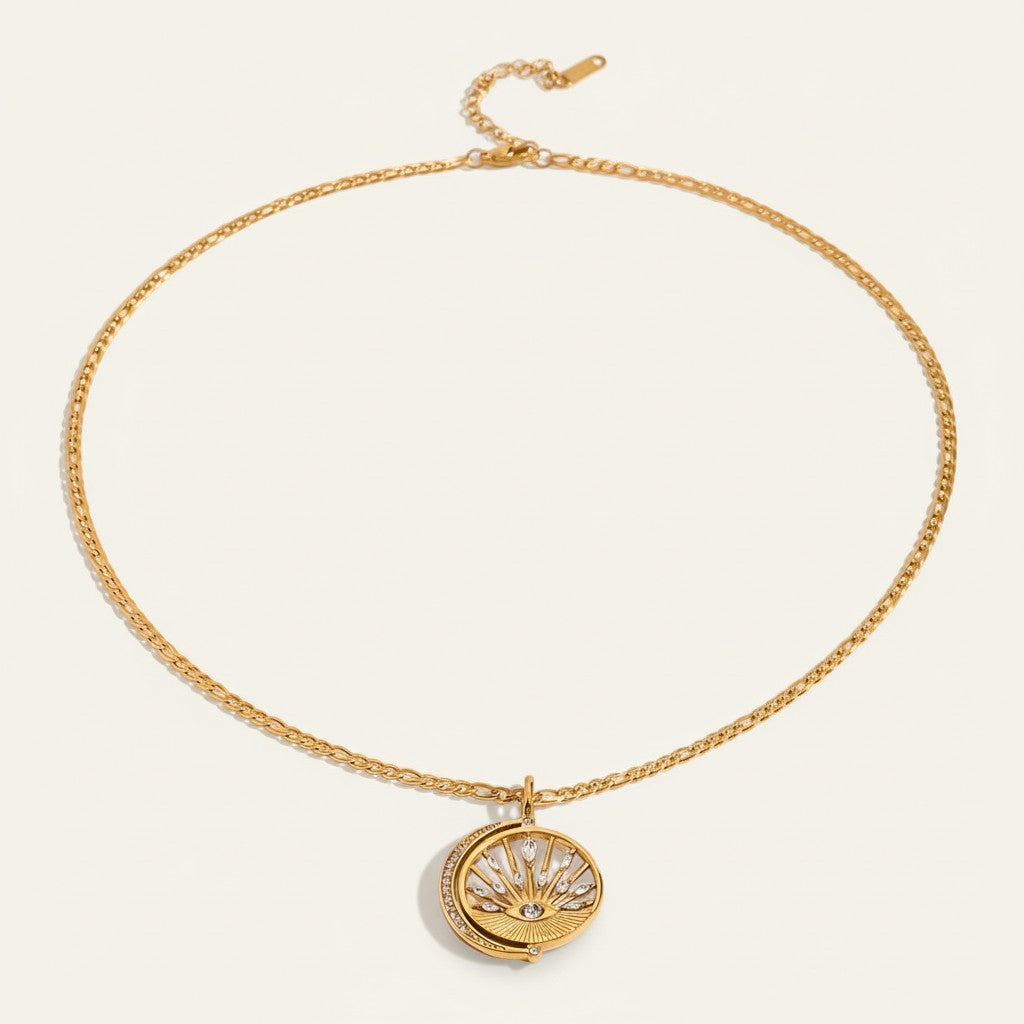 Seraphina Treasures Justina gold necklace with sun and moon celestial pendant featuring white zircon accents.