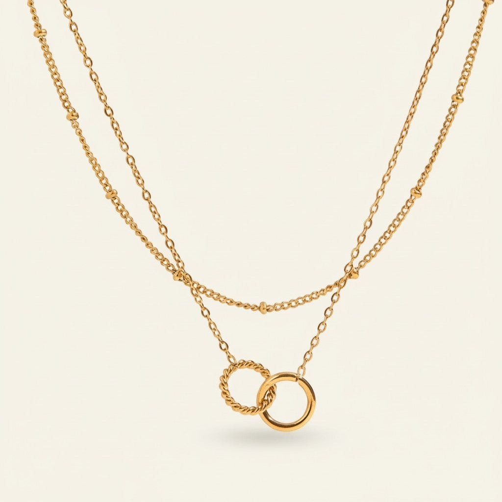 Seraphina Treasures Keeva gold-tone layered necklace with interlocking rings, one twisted, one smooth.
