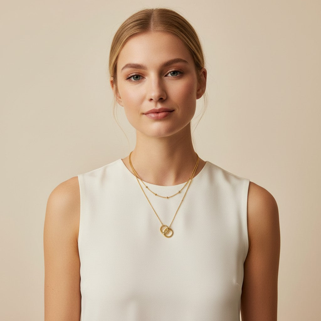 Seraphina Treasures Keeva gold necklace with two delicate chains and interlocking ring pendant.