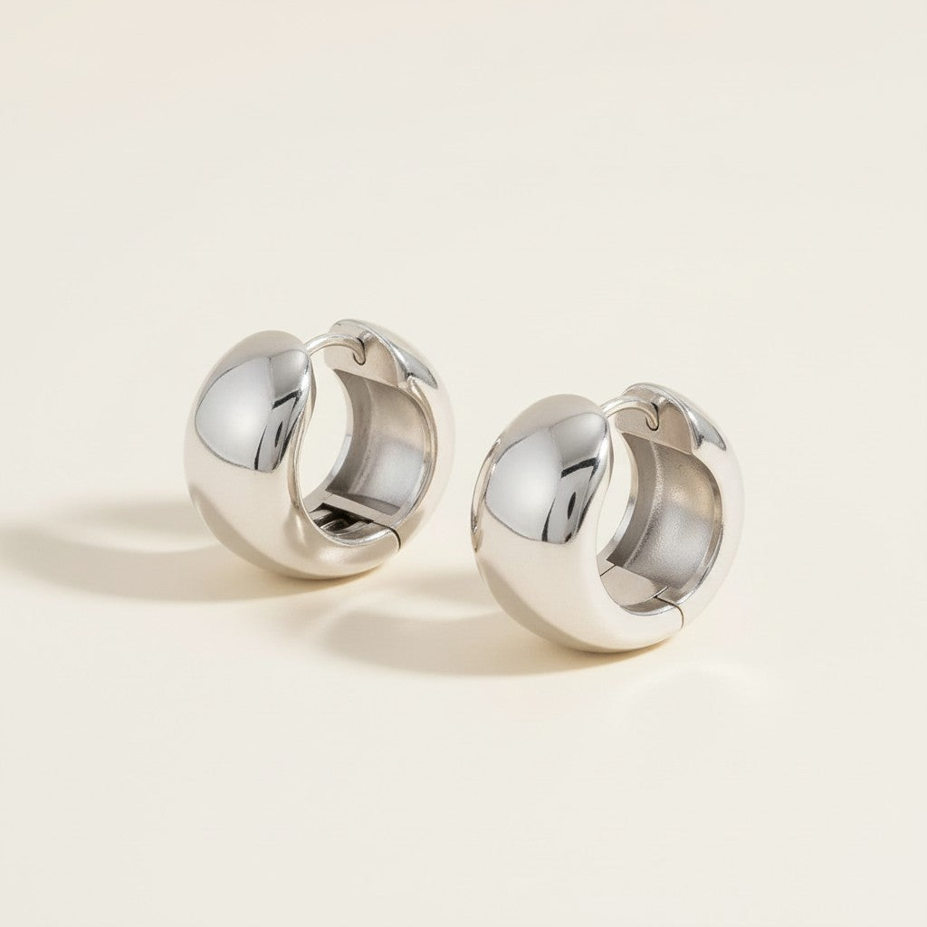 Seraphina Treasures Korvannis silver-tone metal clip-on earrings with a bold, rounded design and secure spring mechanism.