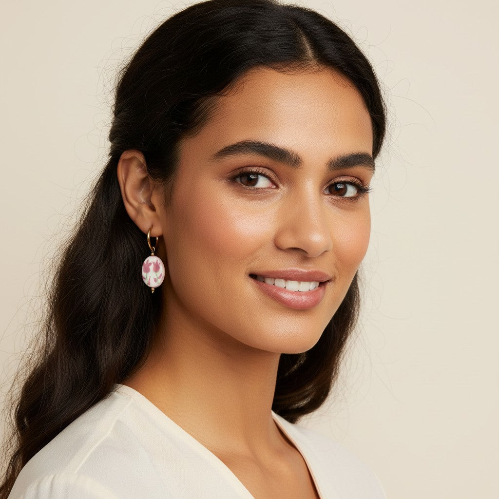 Seraphina Treasures Kyanis Earrings with oval white ceramic drops featuring pink tulips and green stems.