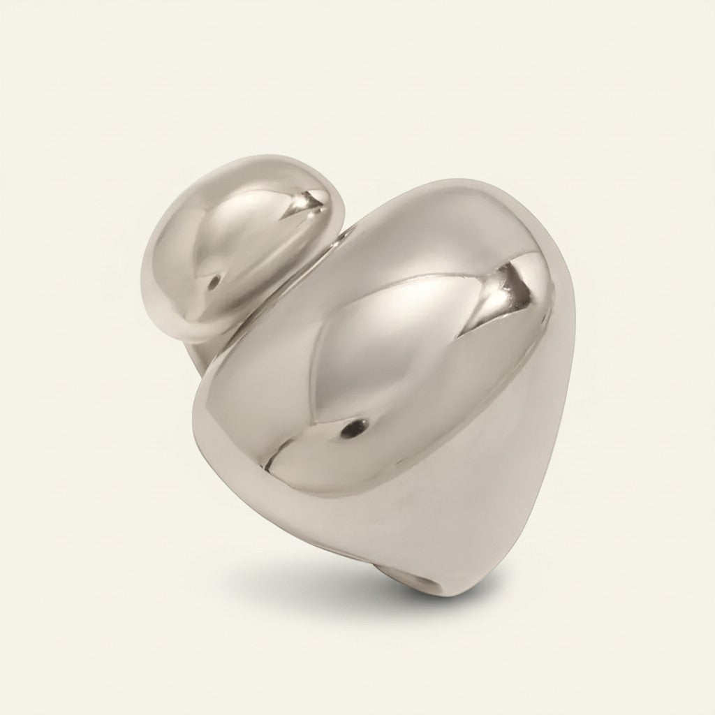 Seraphina Treasures Kyreniax abstract silver-tone metal ring with a modern, sculptural design.
