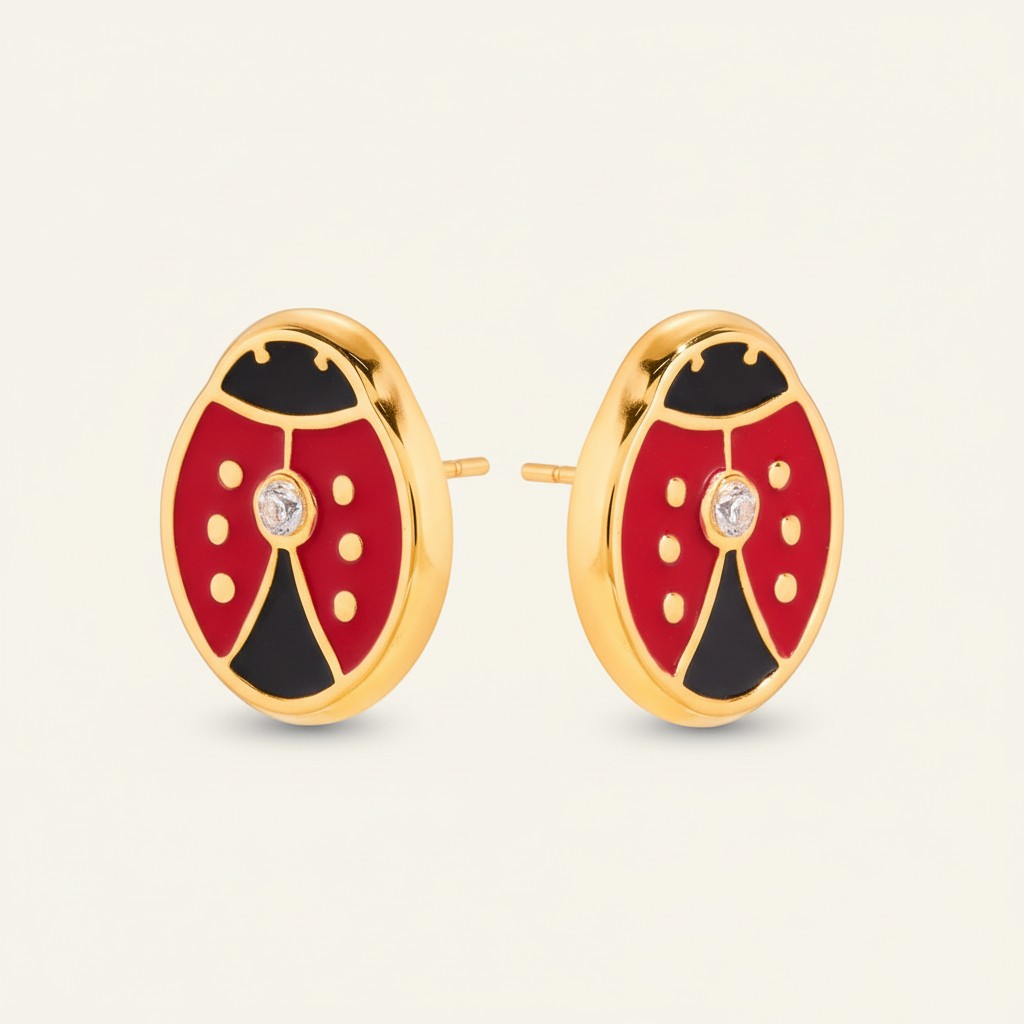 Seraphina Treasures ladybug stud earrings in red, black, and gold with a clear zircon stone. Artistic oil drip finish.