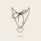 Seraphina Treasures Laurentia necklace with silver heart pendant on black waxed rope, tied with a bow.