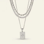 Seraphina Treasures Gaianyx layered silver necklace with geometric pendant and starburst detail.