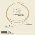 Seraphina Treasures Yasira layered gold necklace with natural pearl pendant. Features three delicate chains of varying lengths.